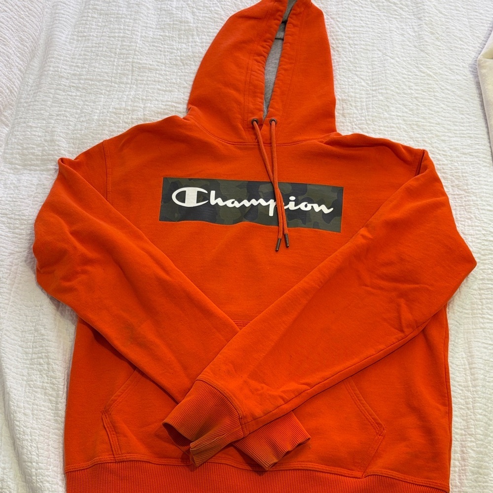 Men’s Champion Bright Orange Pullover Hoodie with Camo Logo Box. Size M.